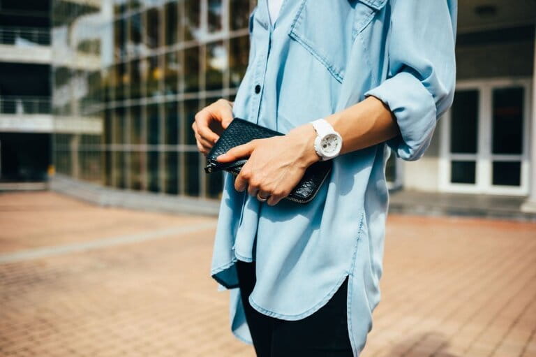 Close-up of young girl wearing blue denim shirt that is wider than her body